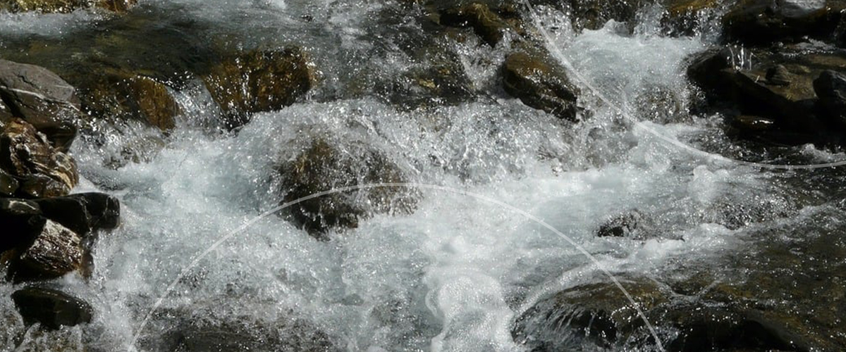 Close-up of fast-moving white water rapids
